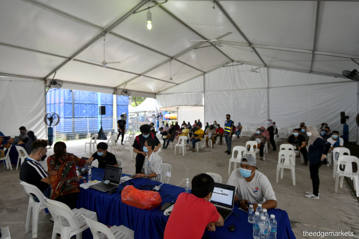 Mobile vaccination at PPR Salak Selatan, Kuala Lumpur yesterday (June 23). (Photo by Sam Fong/The Edge)